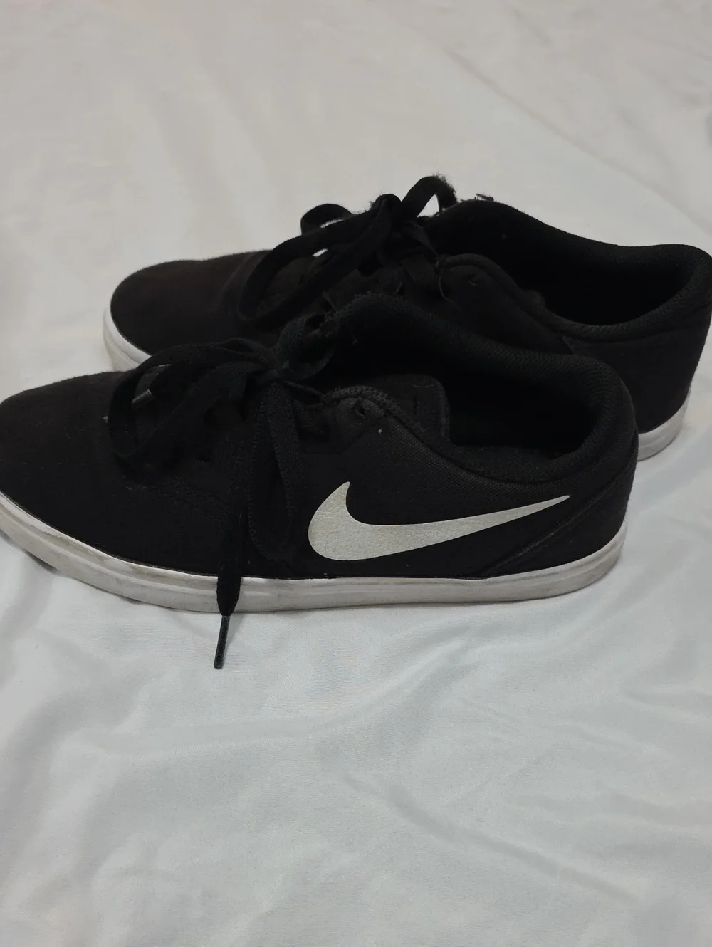 Nike Black Low-Top Sneakers with White Swoosh